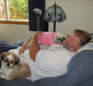 Ling Ling and Tilly snuggling with Daddy.  Note where LL has placed her little butt.  Photo credit: Sandra Bell Kirchman